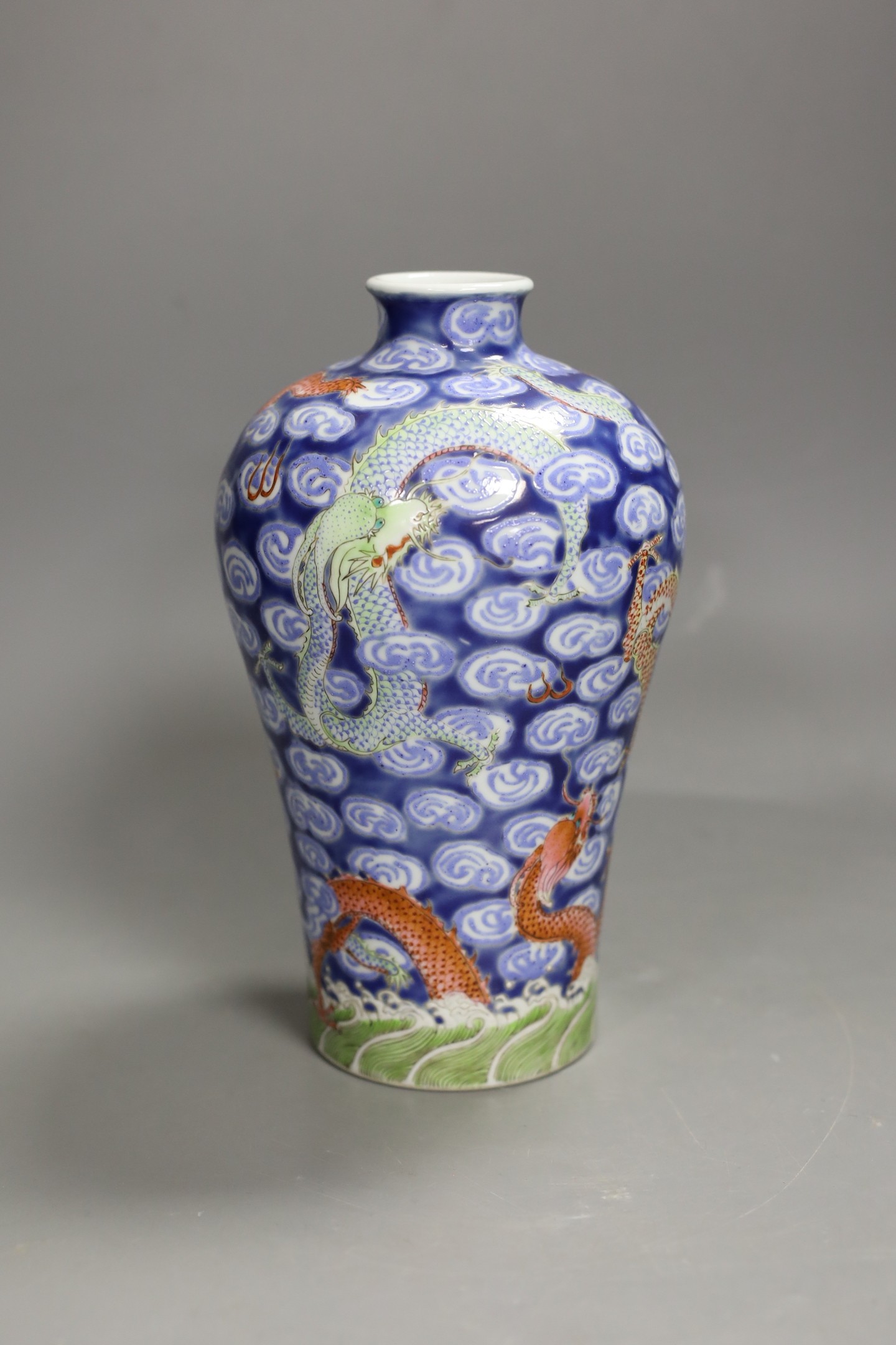 A Chinese famille verte dragon and cloud-fret vase. 20cm high